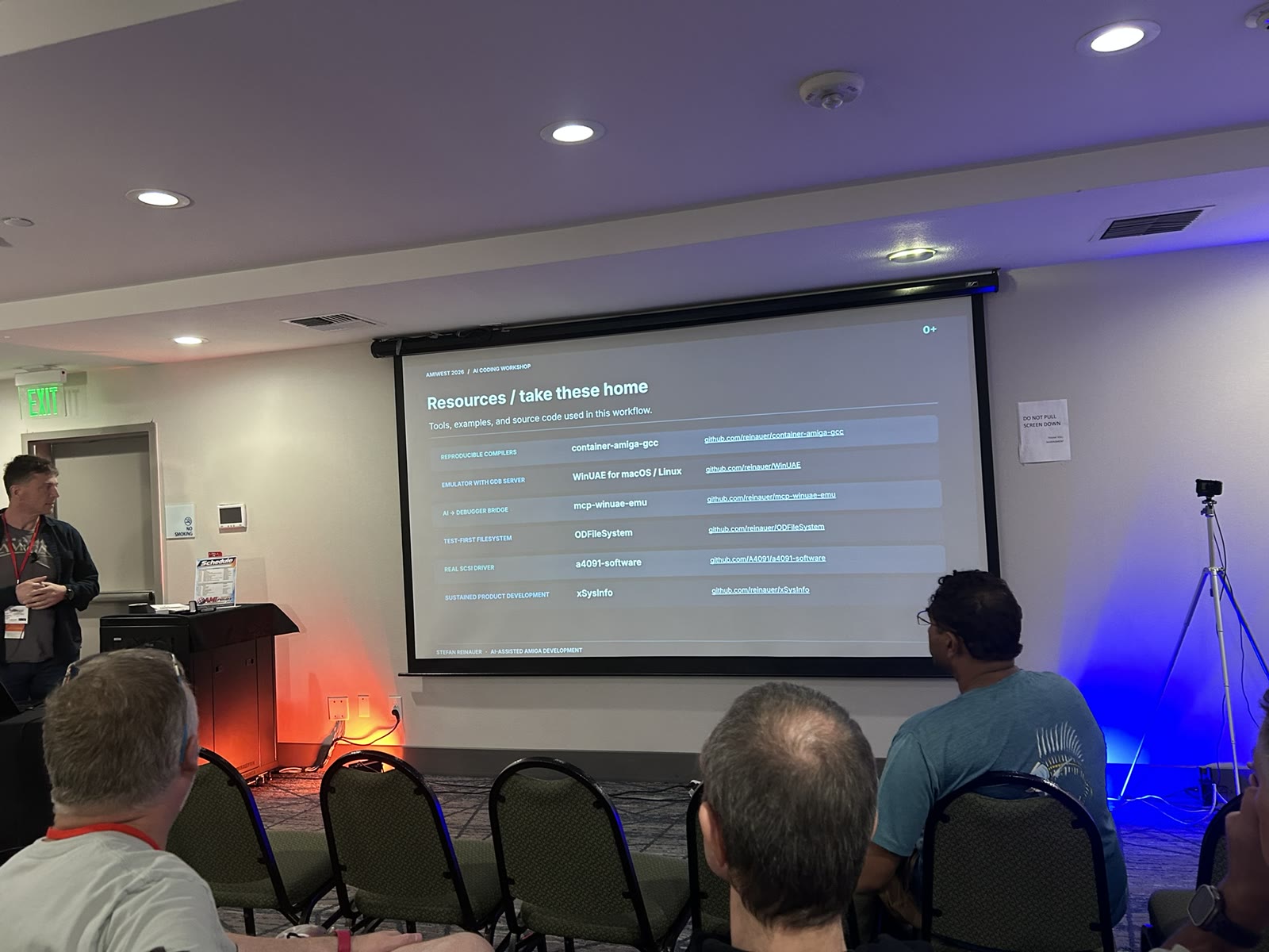 AmiWest workshop resource slide listing compiler, emulator, debugger and Amiga software repositories